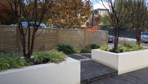 Contemporary slatted fencing in Highgate front garden design