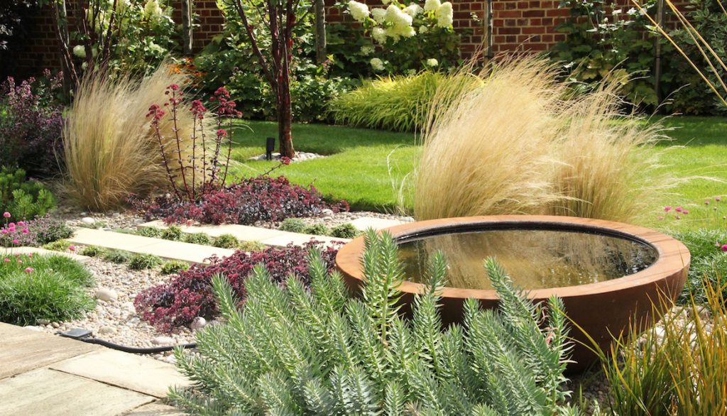 Planting and paving with Urbis water bowl, garden design in Much Hadham