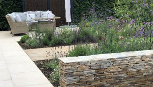 Screen, feature wall and lounge area by garden designer Amanda Broughton